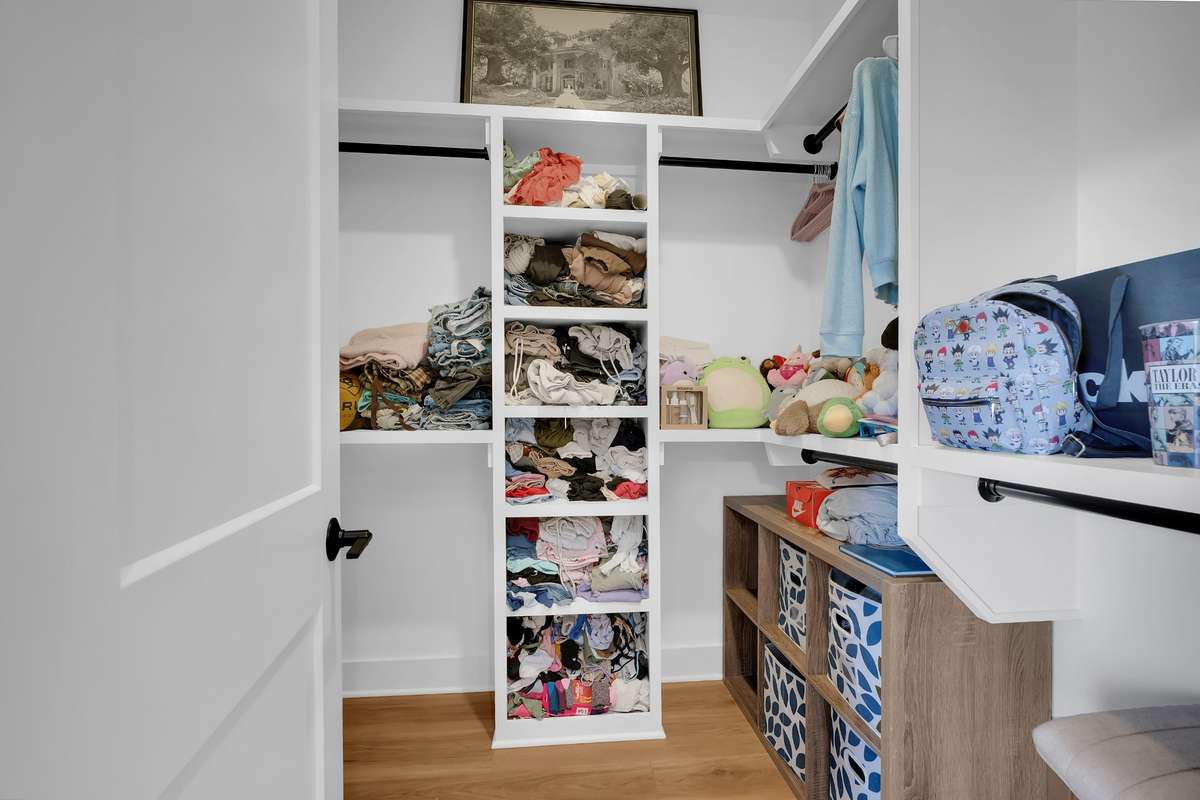 Walk in closet in bedroom 2 with built ins