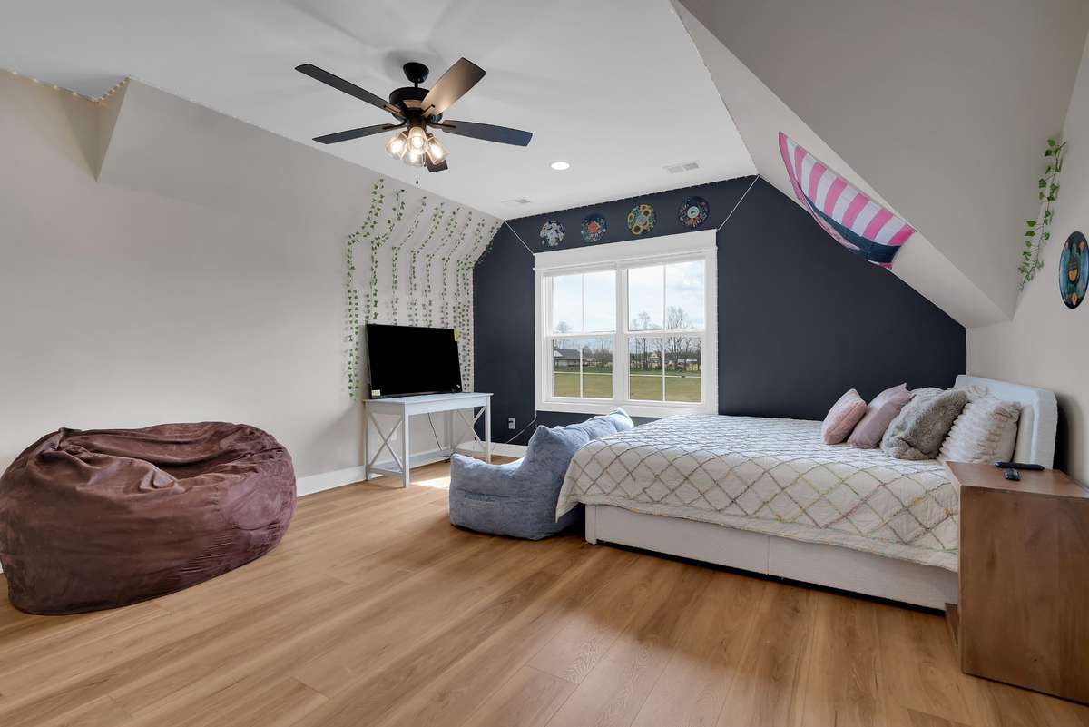 Bedroom 2 with it's own bath, walk in closet and attic walk in storage
