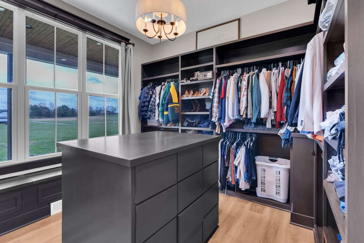 Now this is a primary closet.  Absolutely love the closet layout with the custom built ins