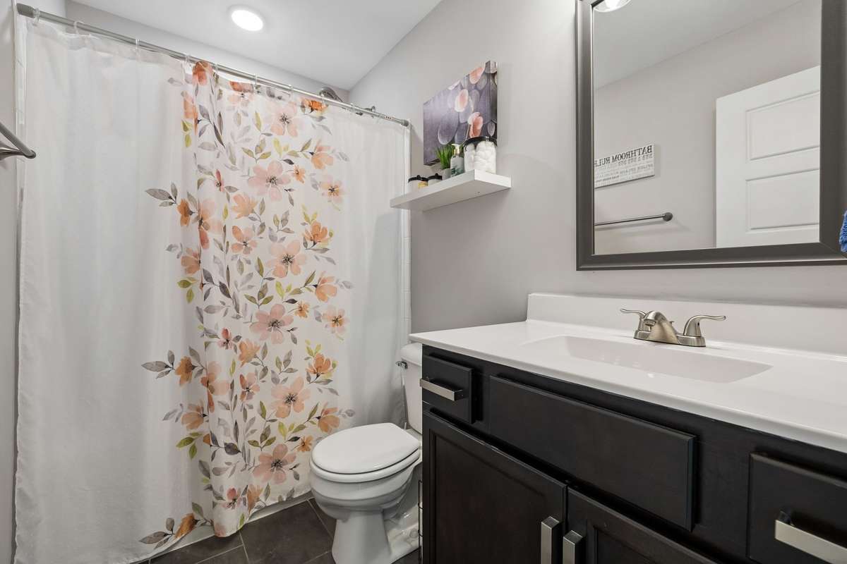 Main Level Guest Bathroom with Shower/Tub Combo
