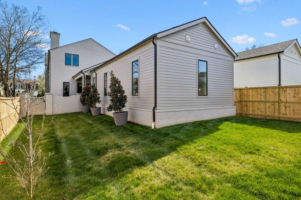 With this L shaped back yard, you can hide the gym set or have a garden and dog agility course.