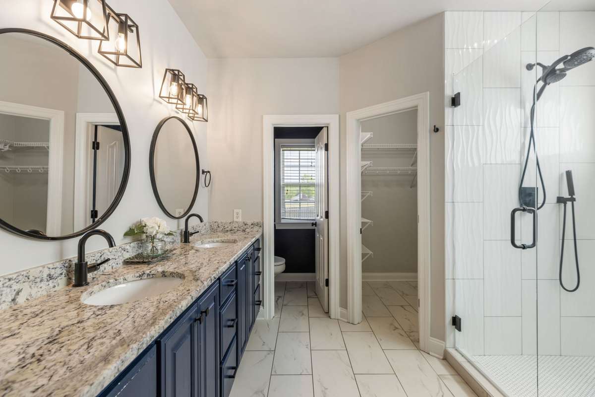 Updated Primary Bath, with granite dual vanities and new shower