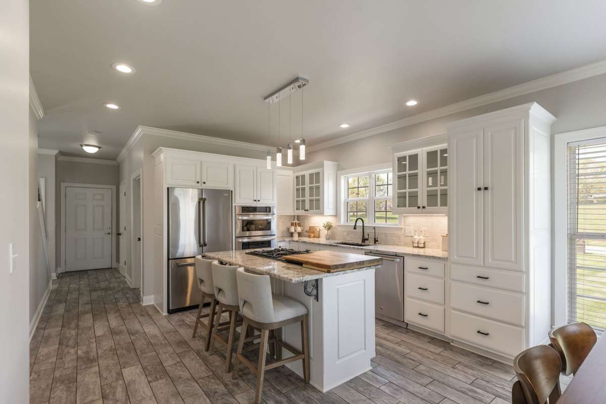 Renovated Kitchen with granite, stainless steel appliances, gas cooktop
