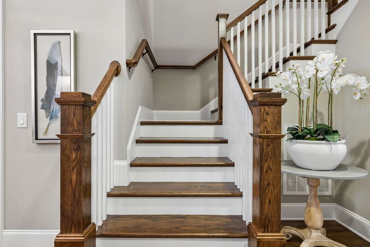 Stairway leading to the bonus room, storage room, two additional bedrooms and two full baths. There is a pull down attic with a 20' x 30' floored space, as well, upstairs.