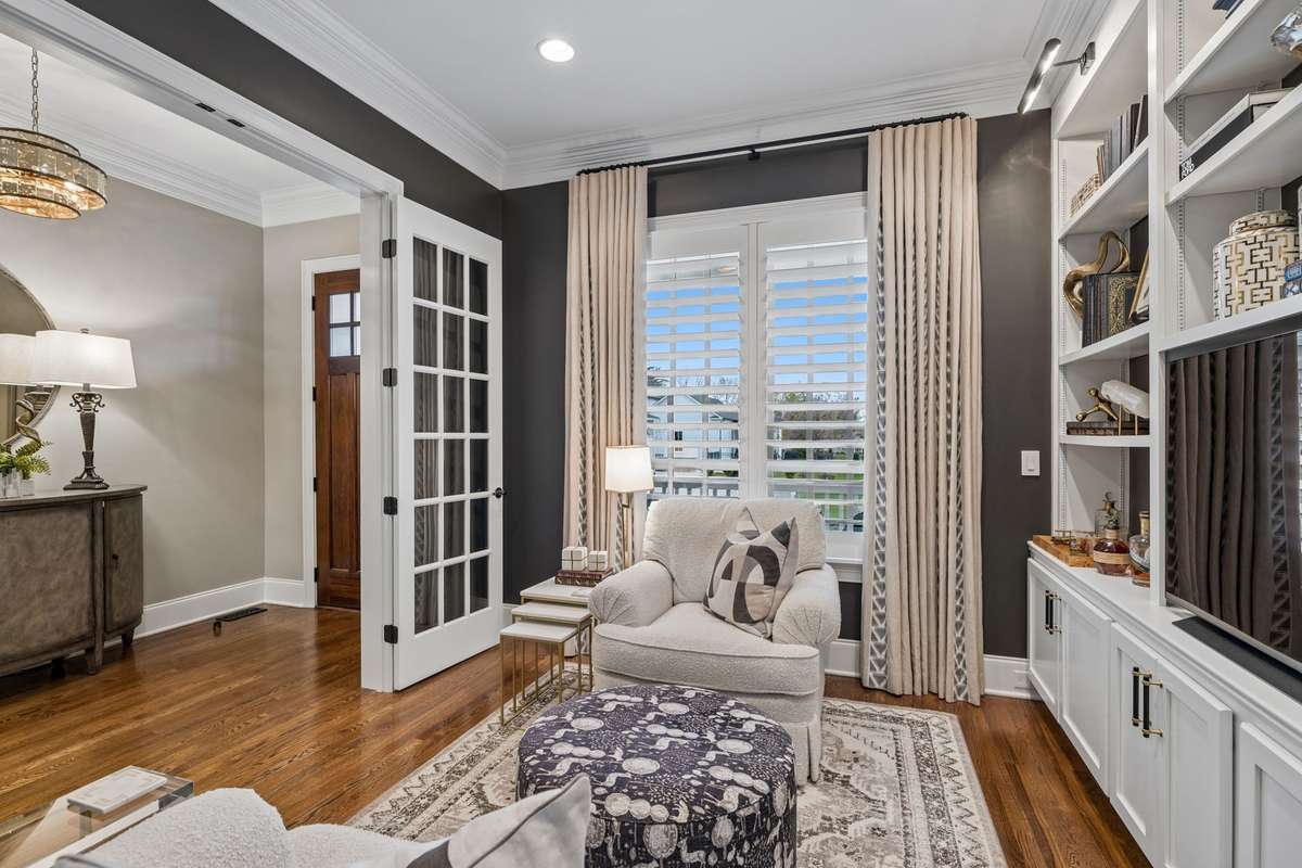 Custom drapes and Plantation Shutters in the Office/Library.