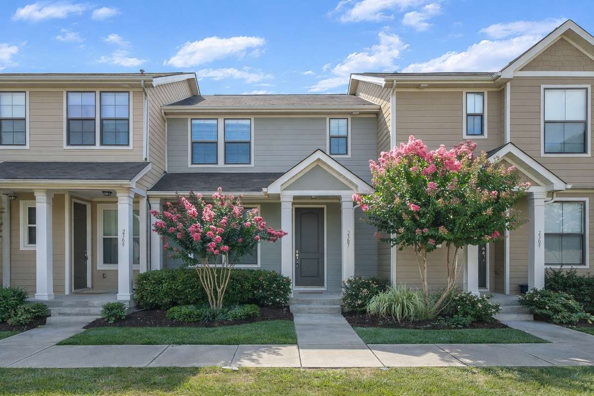 This is what the home looks like when the crêpe myrtles are in bloom. Some images may include virtual staging or minor AI enhancements for illustrative purposes. Landscaping shown may not represent the current condition of the property.