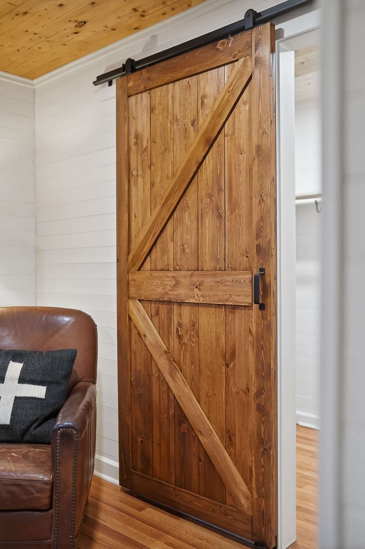 Barn door between bedroom, laundry and bathroom