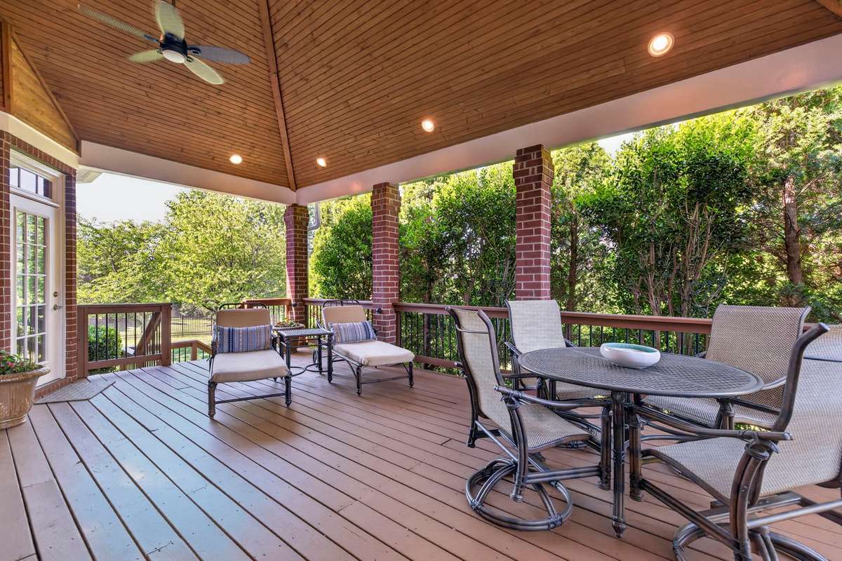 A french door leads from the breakfast nook to the covered deck - a perfect setting for early mornings and evening entertaining.  The landscape  screening provides a natural private setting.