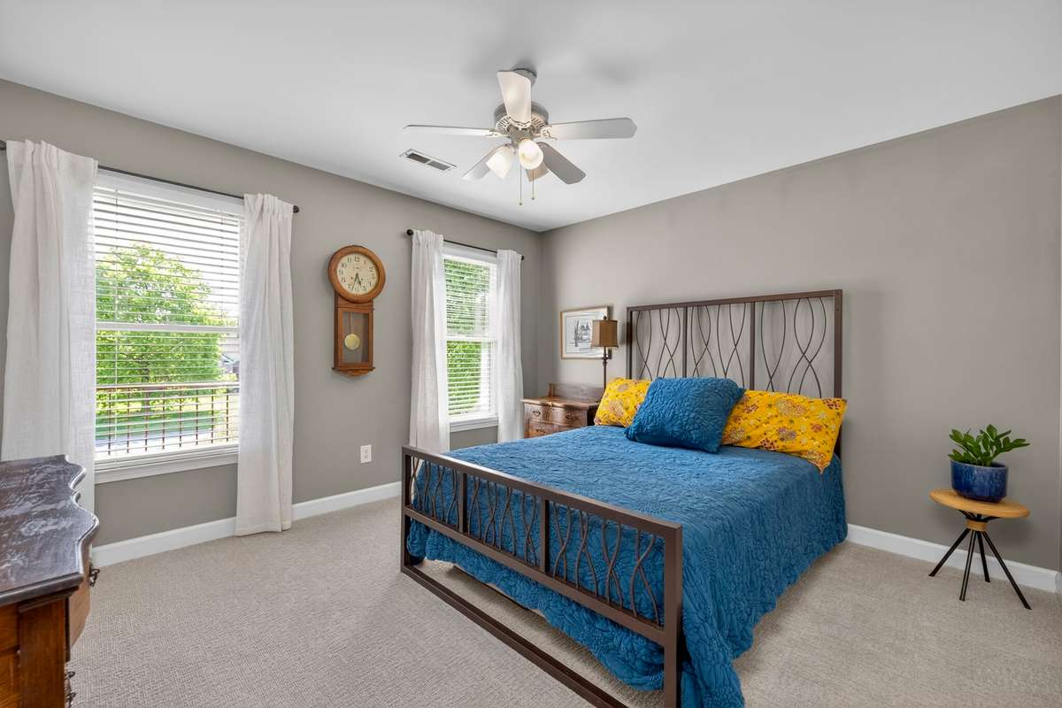 Bedroom four is spacious and connects to bedroom two via a balcony overlooking the circular driveway.