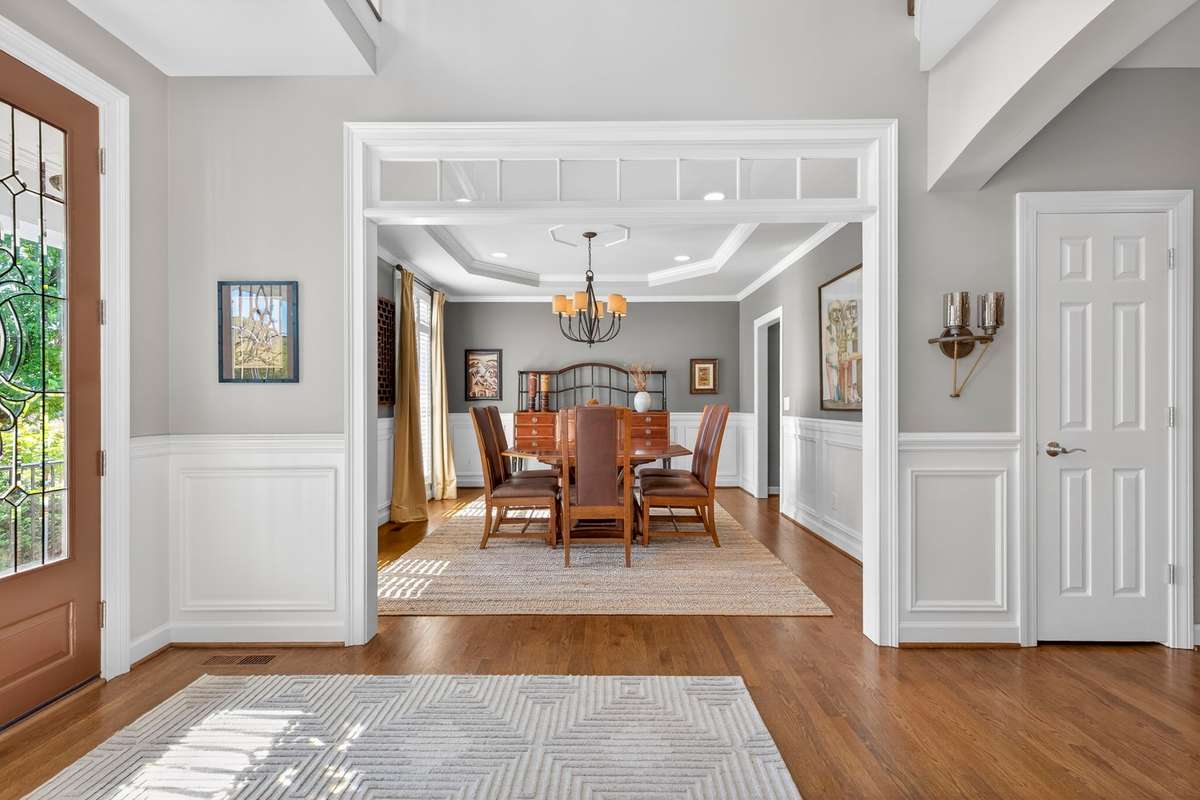 A view from the foyer into the charming dining room entrance and coat closet to the right
