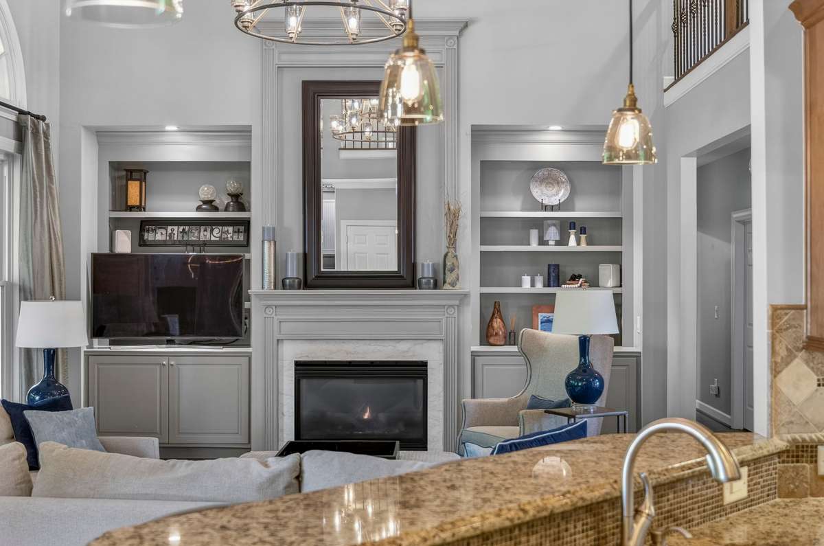 The kitchen gives functional sightlines into the sitting room, making it ideal for entertaining and everyday living.