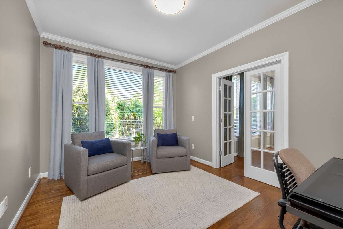 Connected to the master suite by French doors, this flex room is filled with natural light - perfect as a nursery, home gym, 2nd office, or walk-in closet.