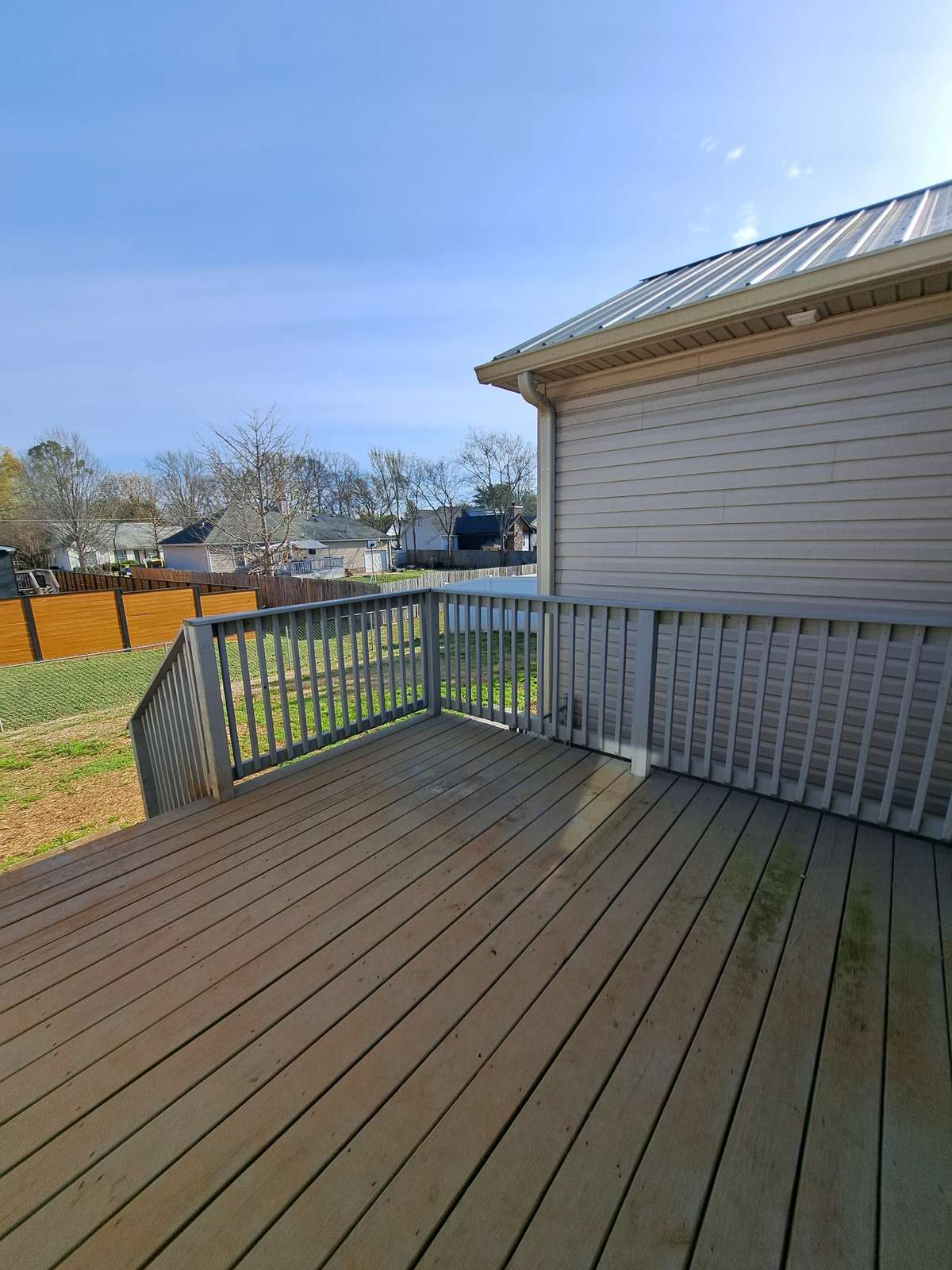 Note the metal roof on apartment.
