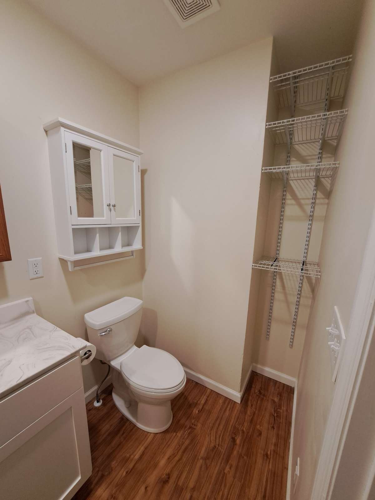 This cabinet stays! Shelving for linens and towels.