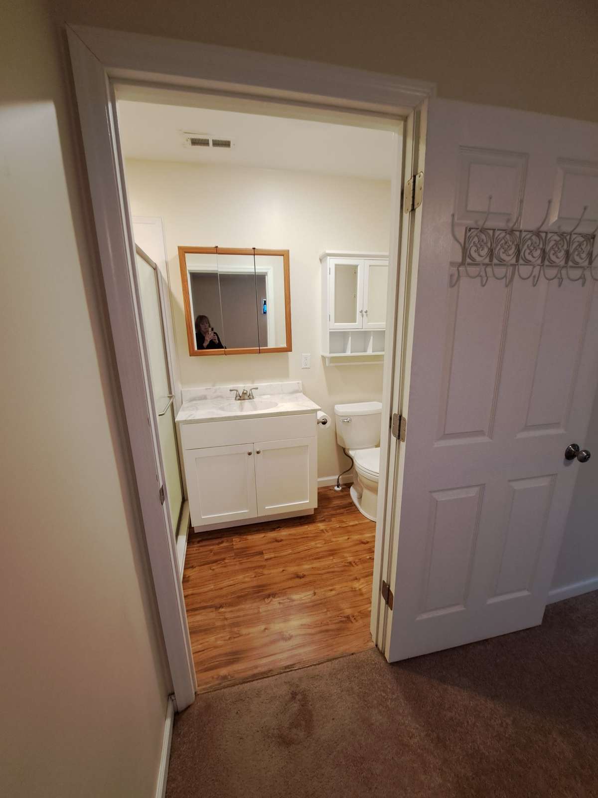 Through the bedroom, looking into the bath