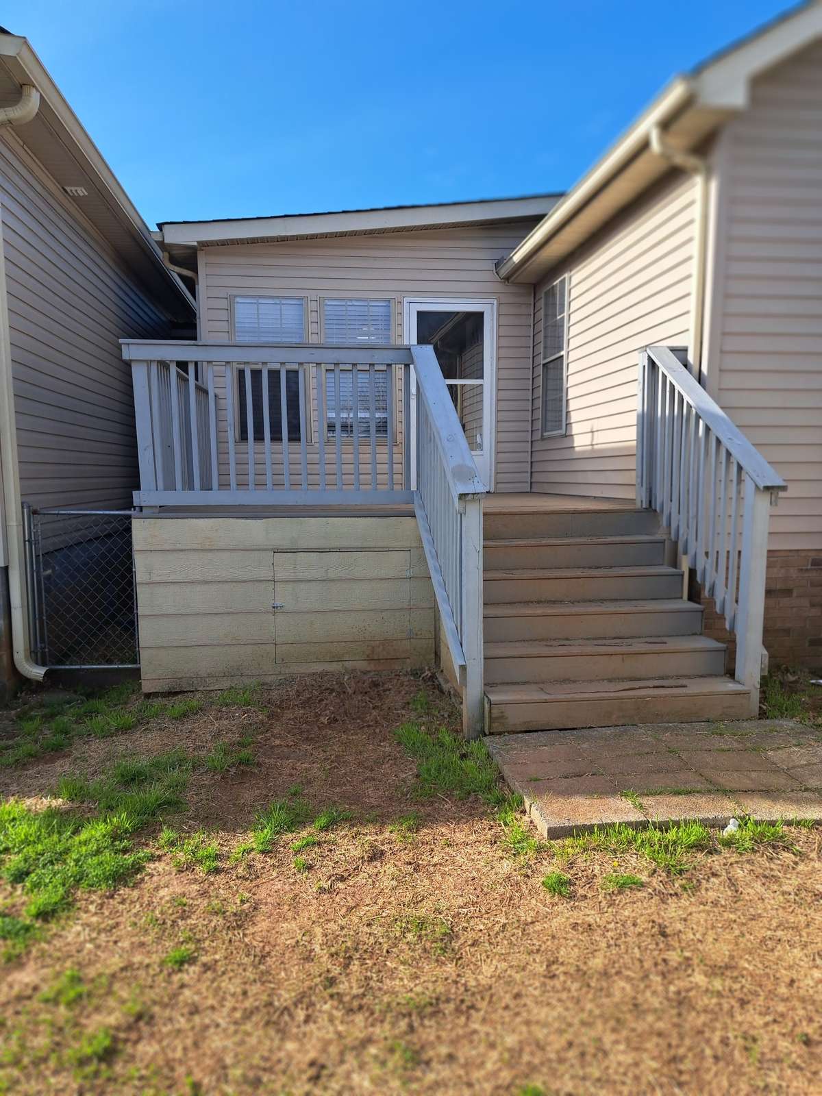 This deck leads into the dining room. There are a couple of dog runs and an RV hookup.
