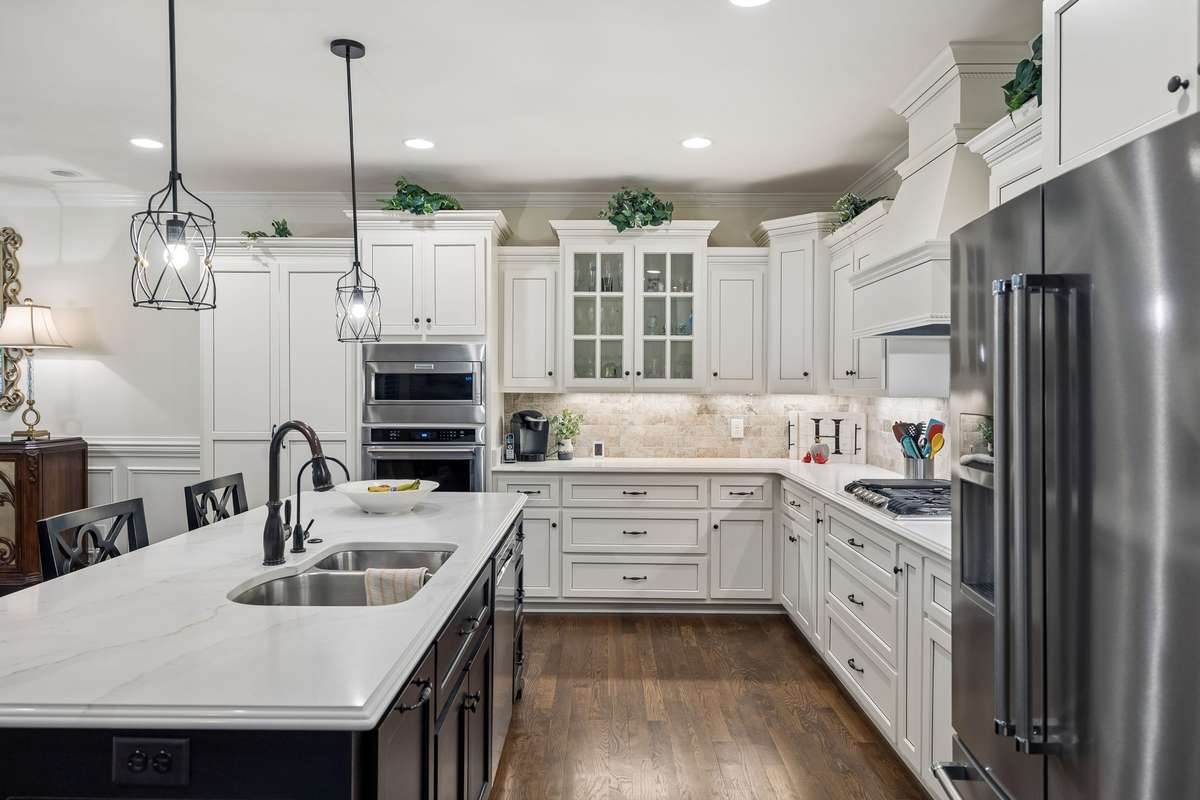 The kitchen features a spacious island and beautiful granite countertops.