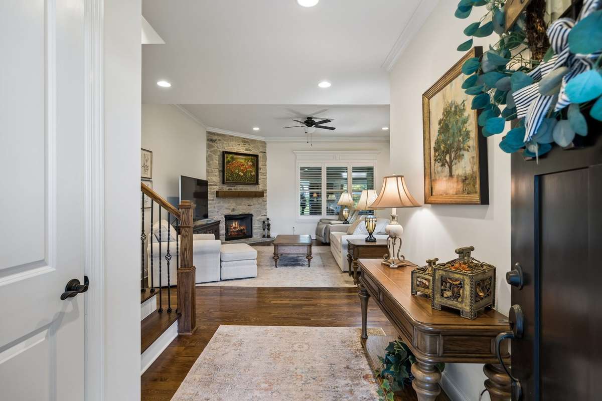Inside, you are greeted by warm hardwood floors and an open, inviting living space.