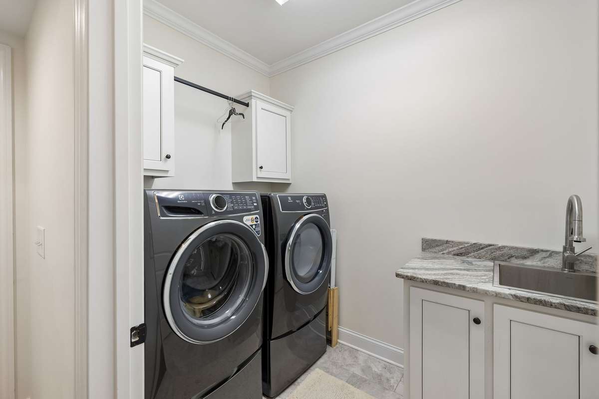 The laundry room is conveniently located near the primary suite.