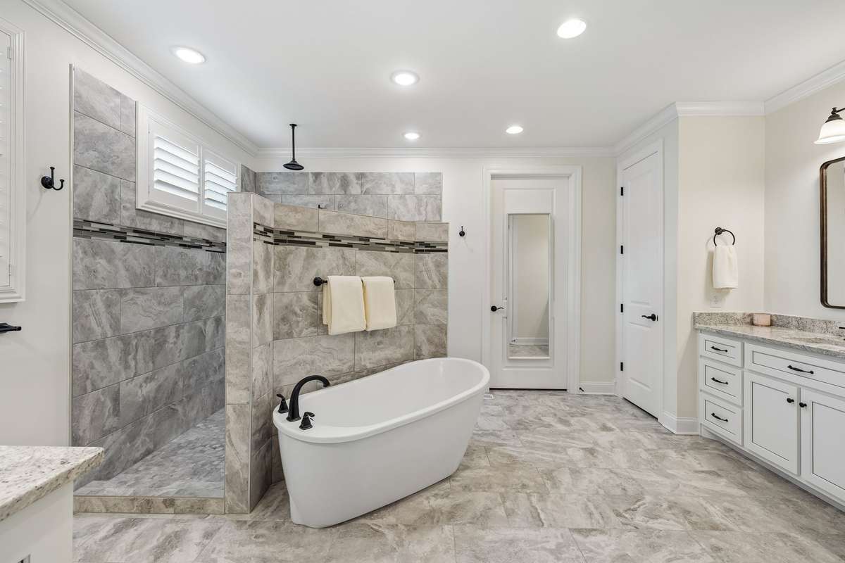 Escape to your en suite bathroom with a soaking tub and luxurious walk-in shower.