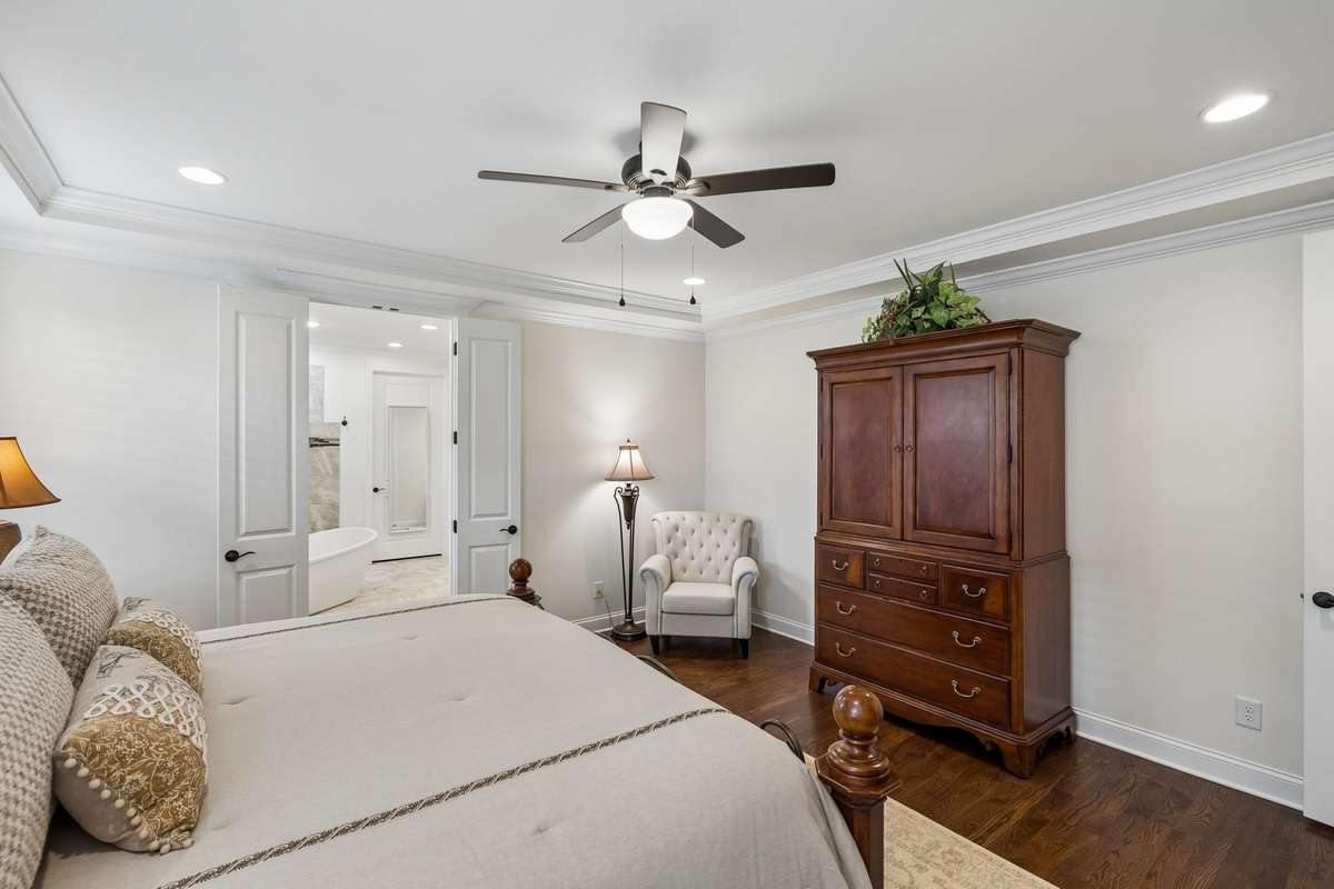 The detailed ceilings and hardwood floors add to the room's warmth.