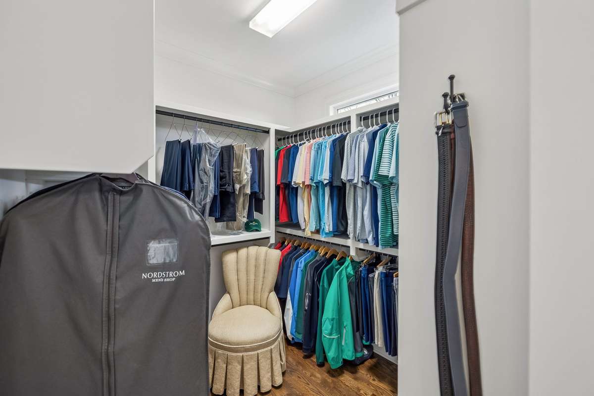 The primary suite includes a spacious walk-in closet with room for his/her sides.