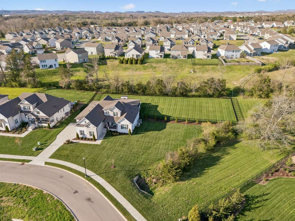 The lawn is beautifully maintained on almost 2/3 of an acre adjacent to common space.