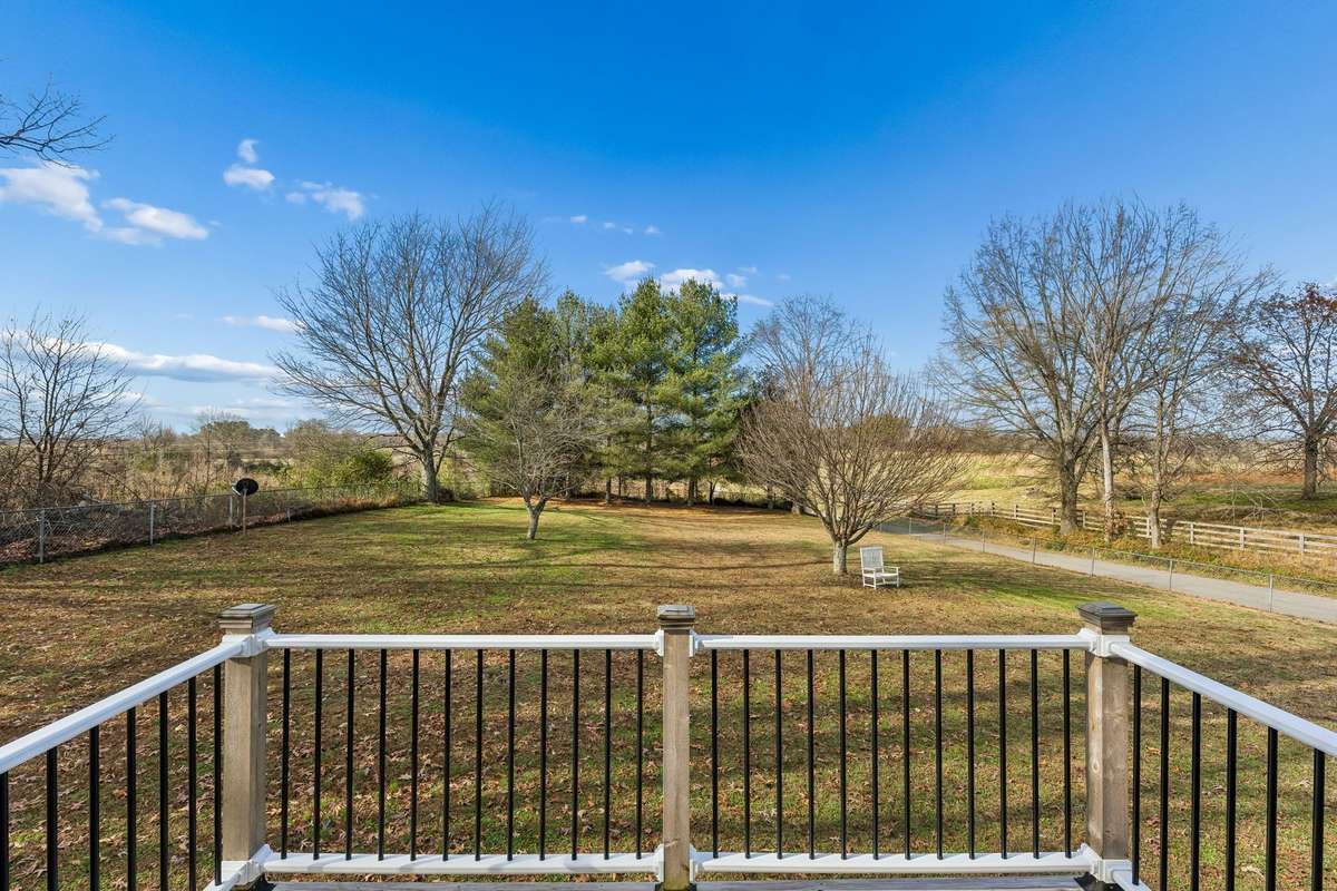 Private deck overlooking side yard.