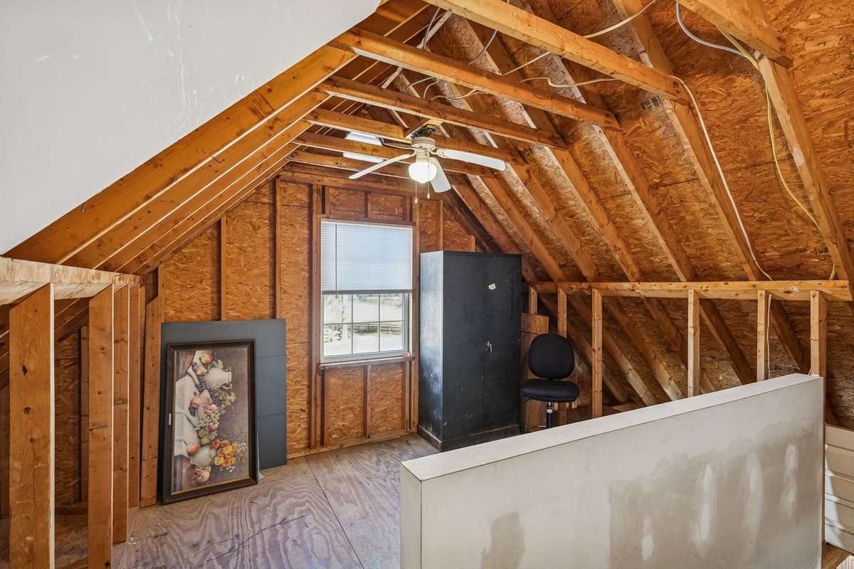 Unfinished above the garage. Great storage.