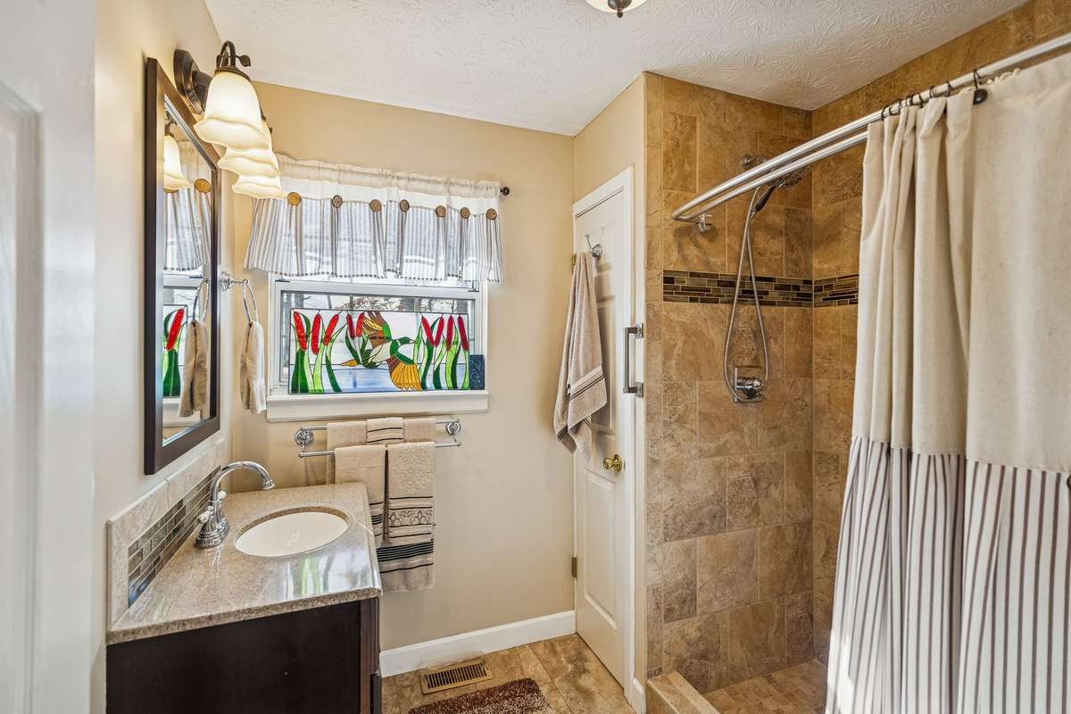 Owners suite has walk in shower.