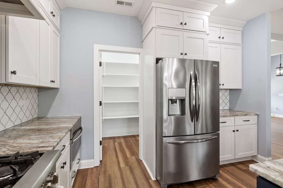 Stainless Steel Appliances and Very Large Panty in Kitchen.  There is a Coffee Bar here also