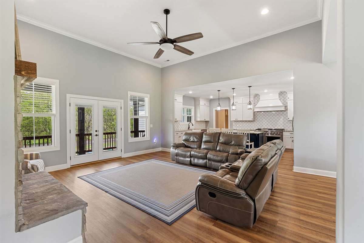 Den with Fireplace and Open into Kitchen