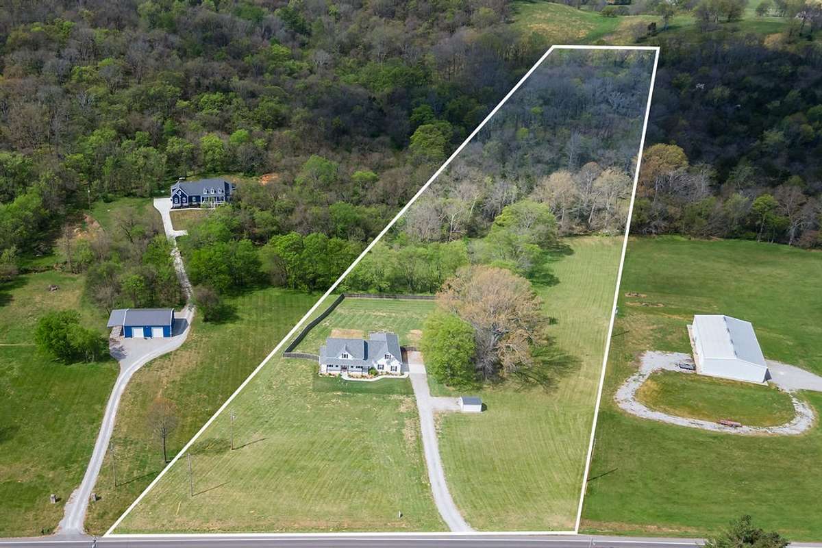 Drone view of the homes and 12 acres. Lots of trails for hiking and bike riding.