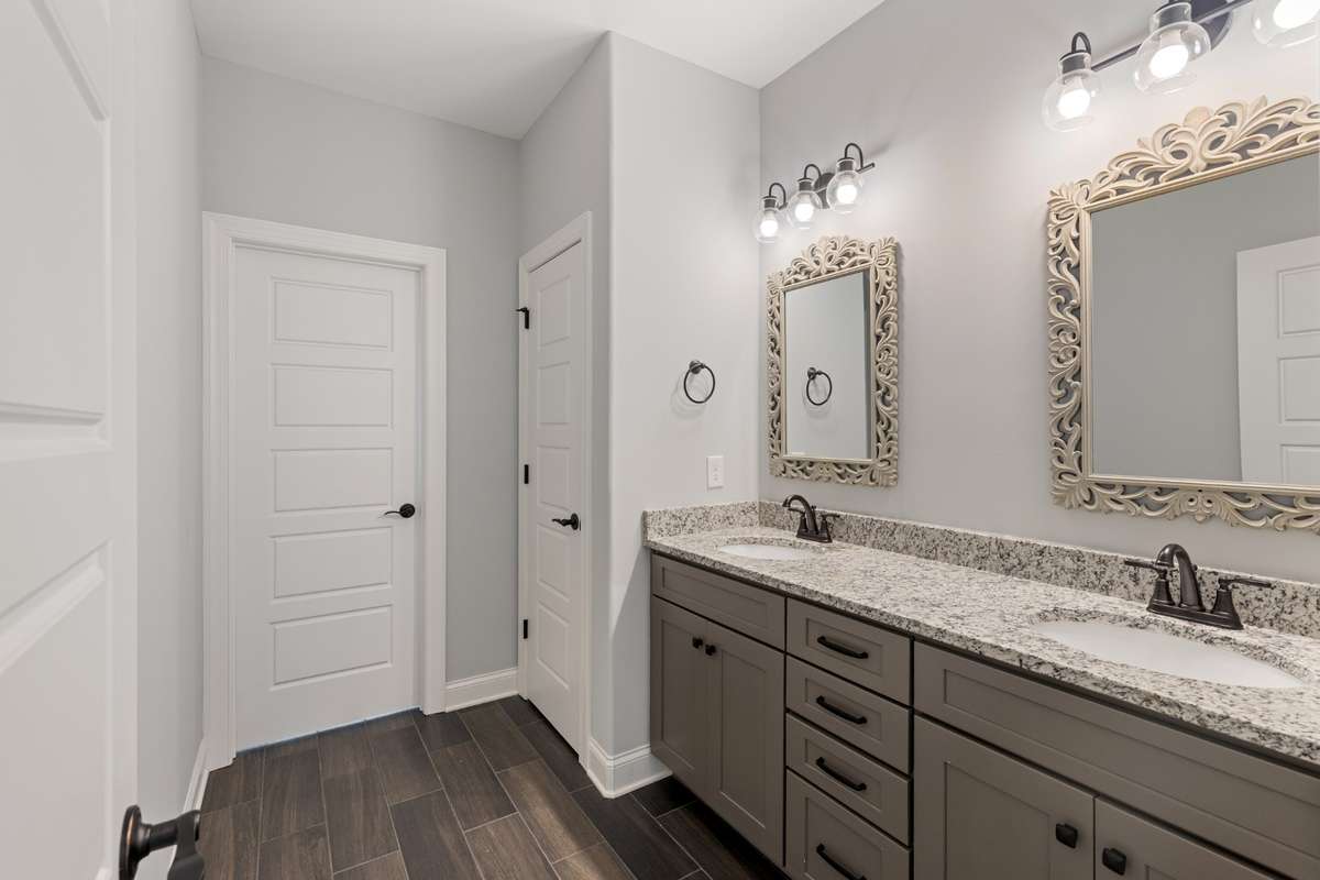 Hall Bath with Double Sinks, Wood Floors and Tub/Shower