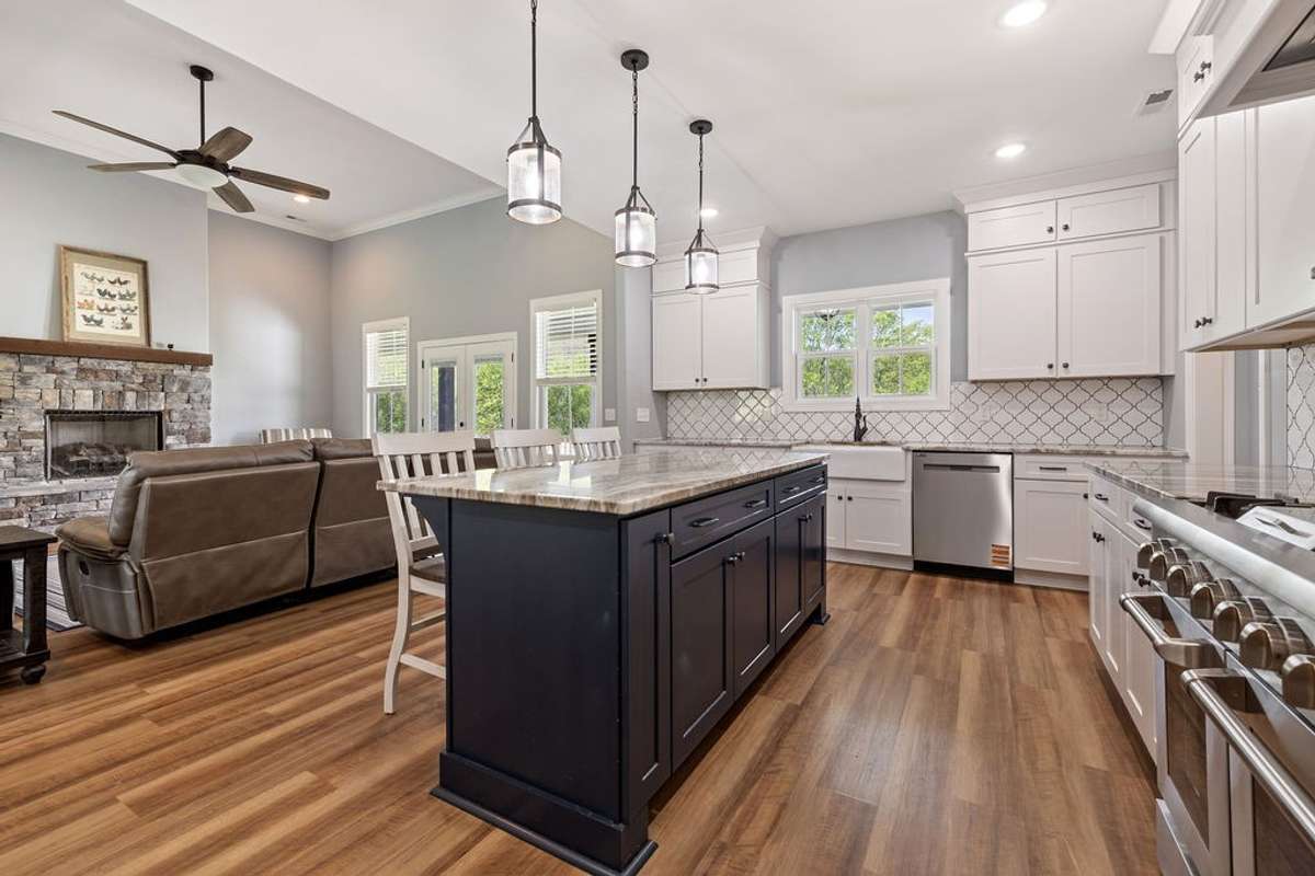 Another view of Kitchen looking into Den.  This photo shows how open the floor plan is.