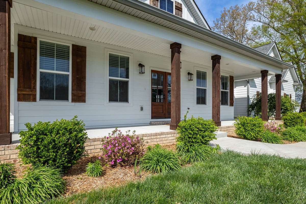 View of Rocking Chair Front Porch with all the flowers in bloom