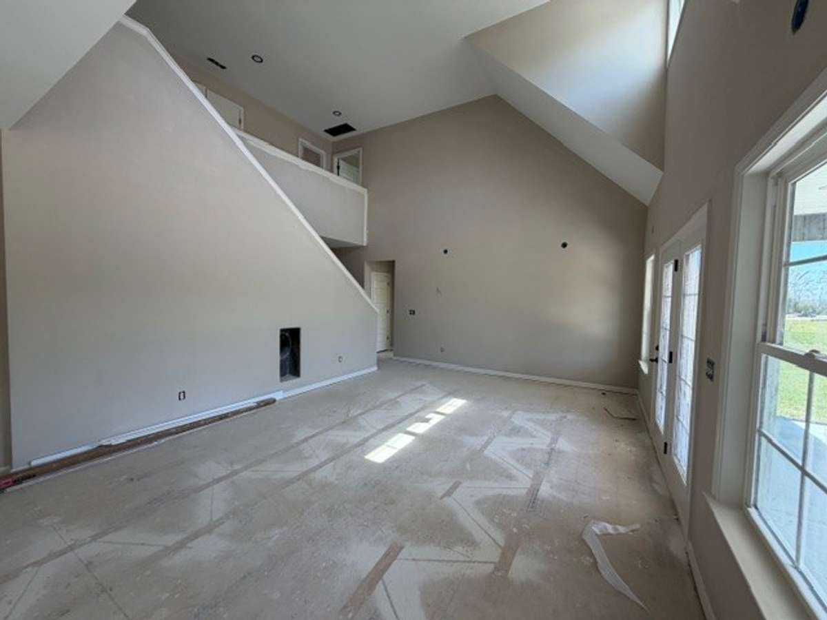 Soaring ceiling in great room.  Plenty of windows for added light.