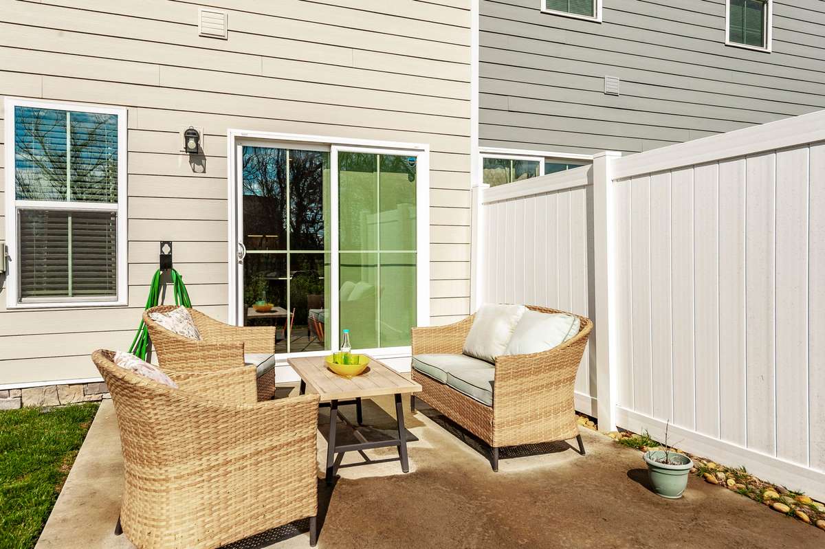 The back patio has easy access from the kitchen and dining area makes this patio ideal for indoor-outdoor entertaining.