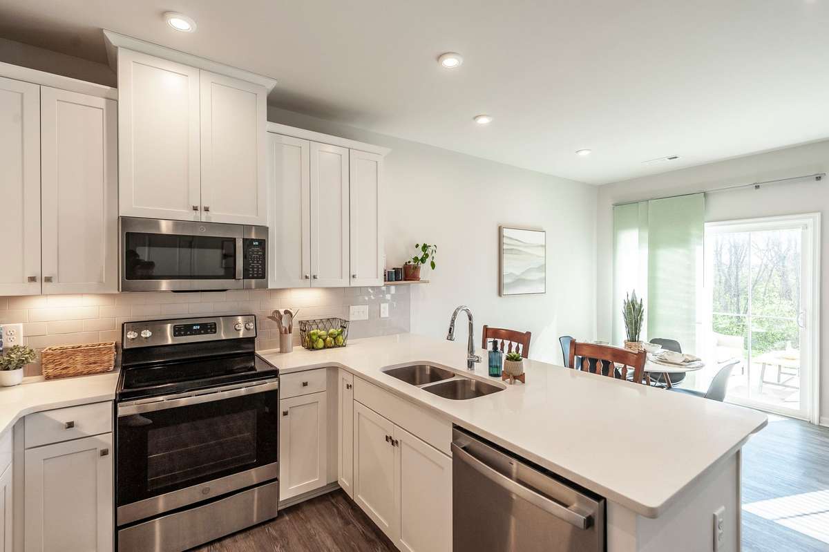 Open layout seamlessly connects the kitchen to the dining and living areas, perfect for entertaining and everyday living.