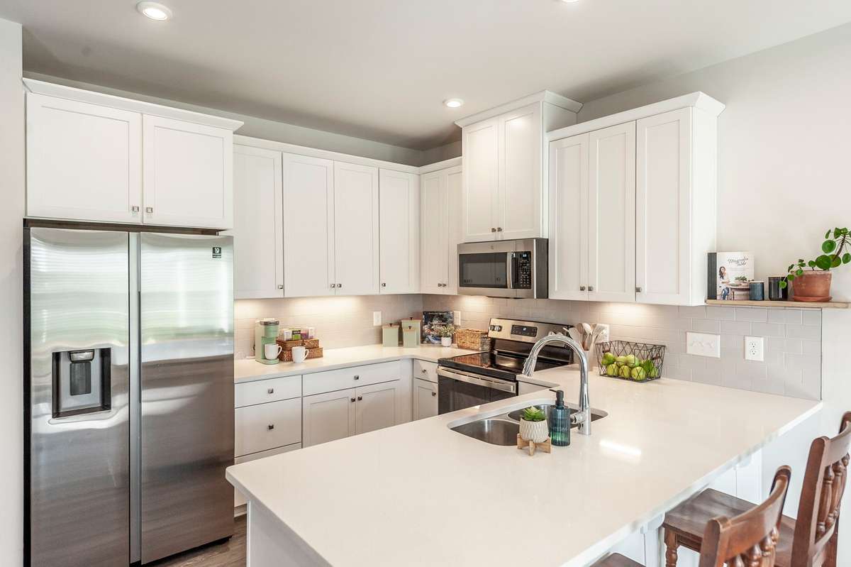 Under-cabinet task lighting highlights the counters and provides practical illumination for cooking and meal prep.