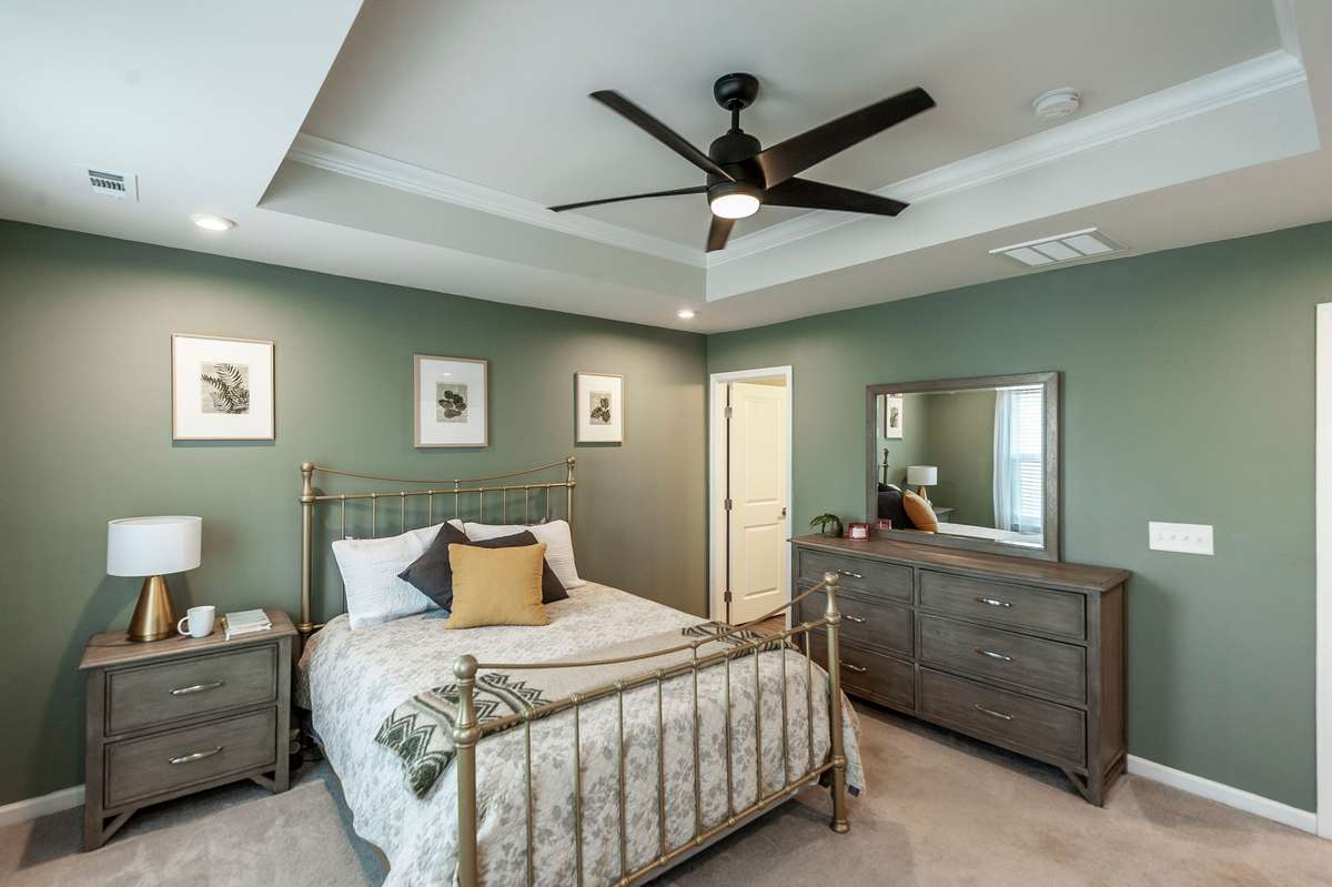 Elegant trayed ceiling adds architectural interest and a sense of height to the room.
