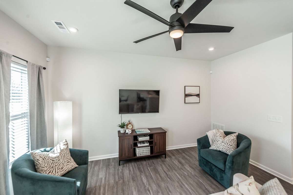 Durable luxury vinyl plank flooring throughout the main level adds both style and low-maintenance living.
