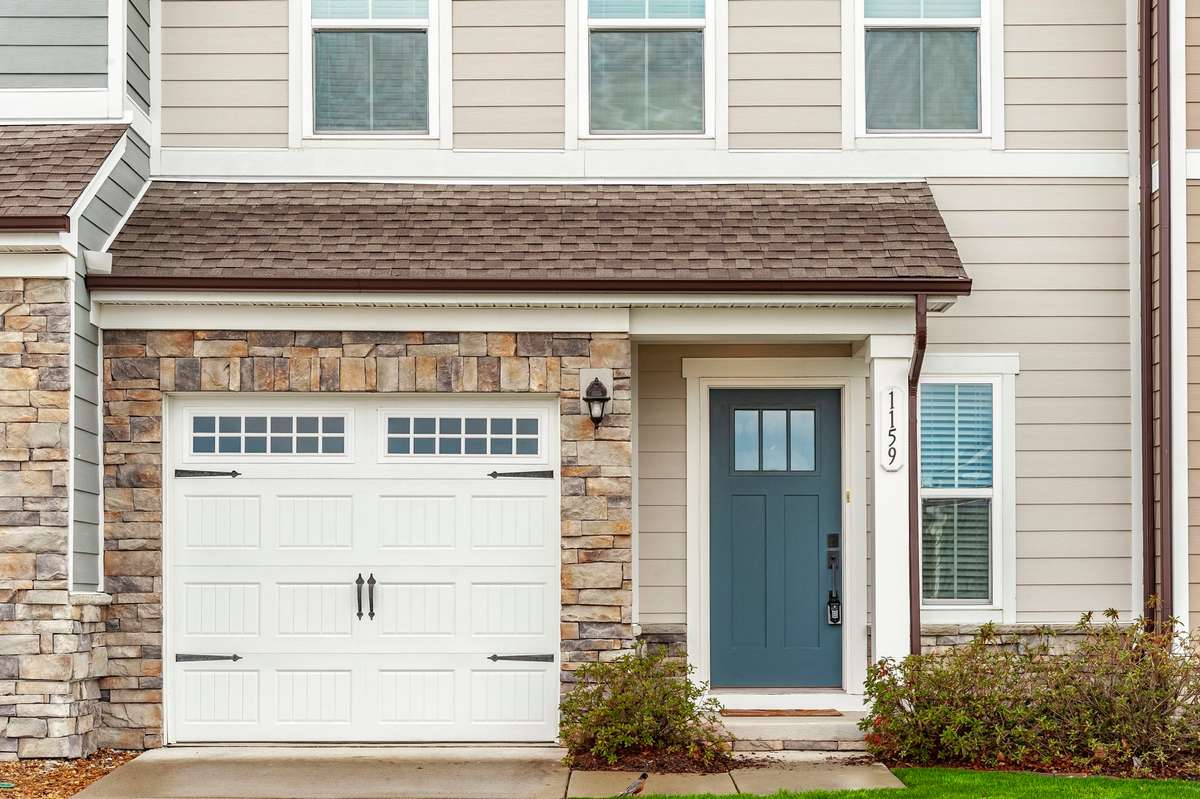 Private one-car garage paired with a spacious driveway, plus the added bonus of nearby guest parking just steps away.