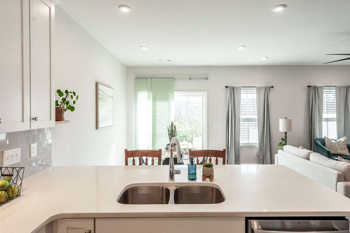 Spacious kitchen island provides additional prep space, storage, and a natural gathering spot for family and guests.