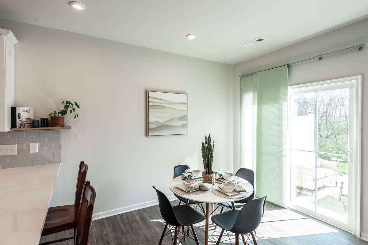 Eat-in dining area perfectly positioned by the back patio doors, offering easy access for indoor-outdoor dining and entertaining.