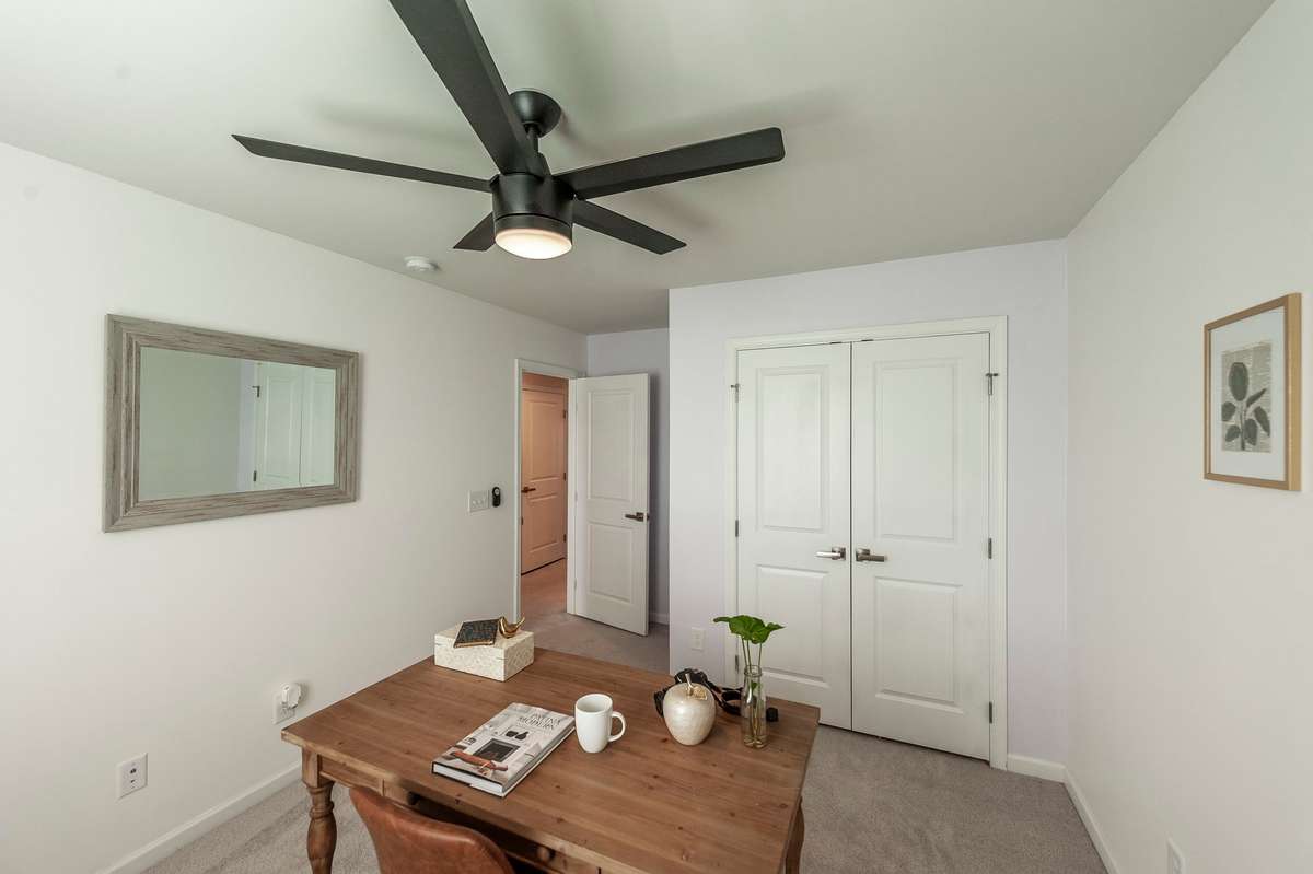 One guest room currently functions as an office, showcasing the flexibility of these spaces for work or sleep.