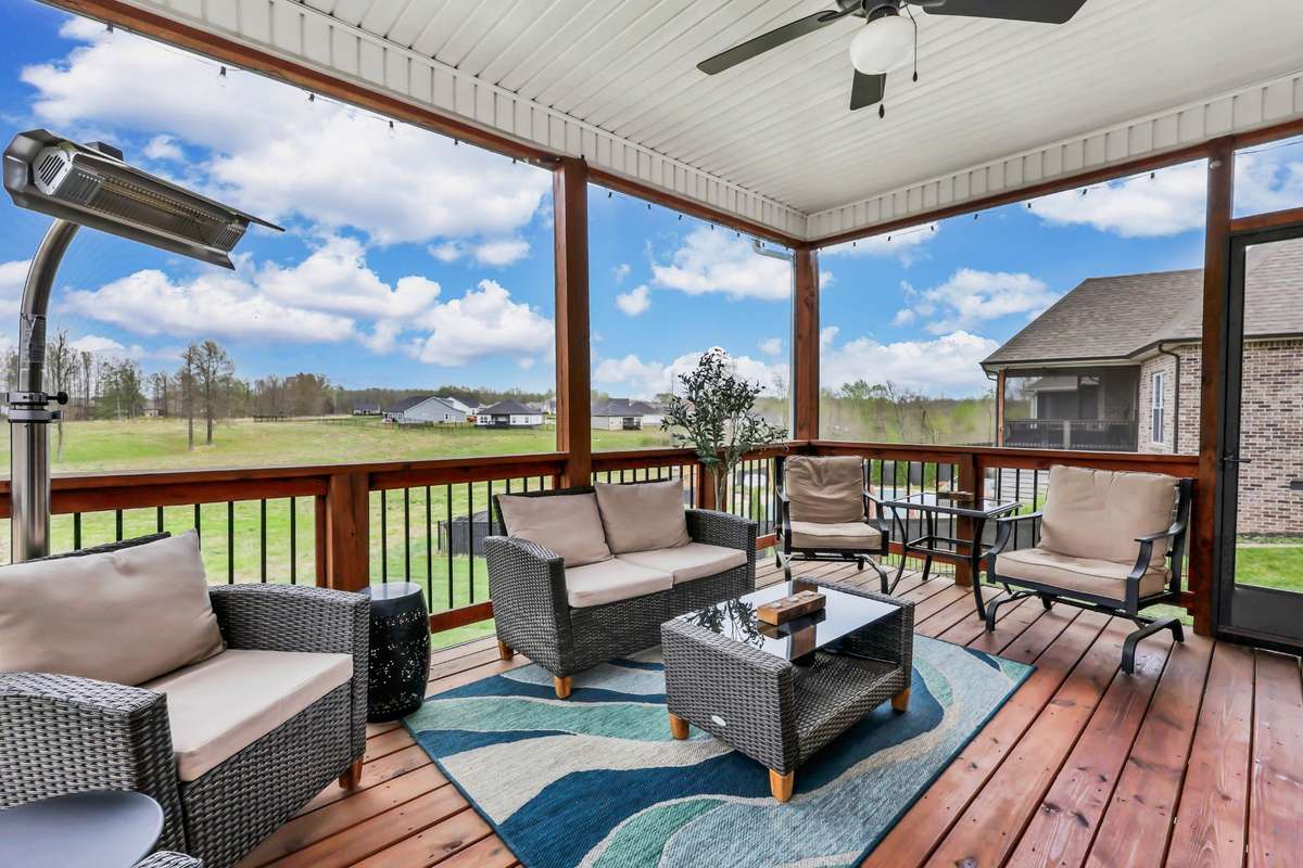 Whether you're hosting guests or unwinding with a quiet evening, this outdoor living space provides the perfect blend of comfort, privacy, and scenic views. The screened enclosure allows you to cozy up while staying protected.