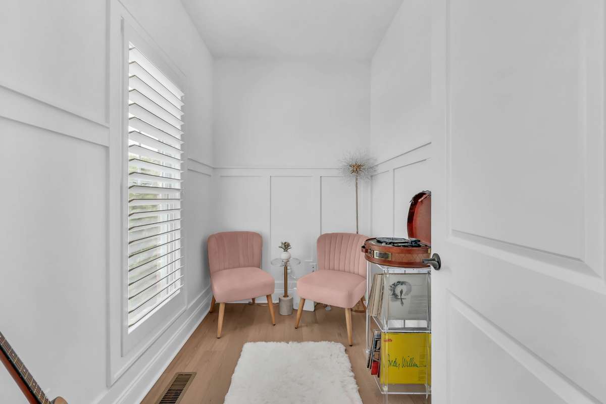 This charming flex space offers the perfect blend of style and versatility. Bathed in natural light from the large window, the room feels bright, airy, and inviting—ideal for a cozy sitting area, reading nook, music room or a stylish home office.
