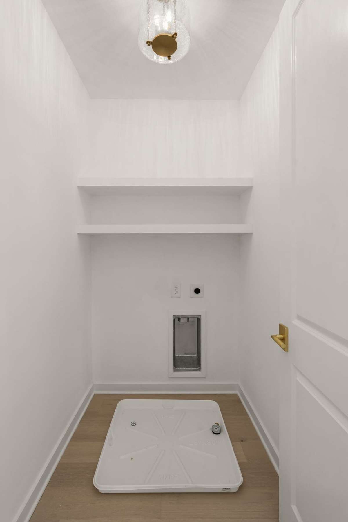 Laundry room adjacent to primary suite for ease