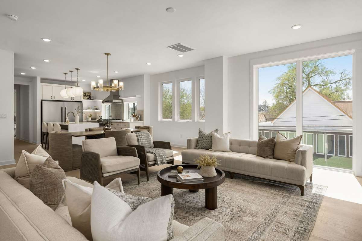Open concept living space with oversize windows